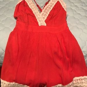 Coral romper with cream lace